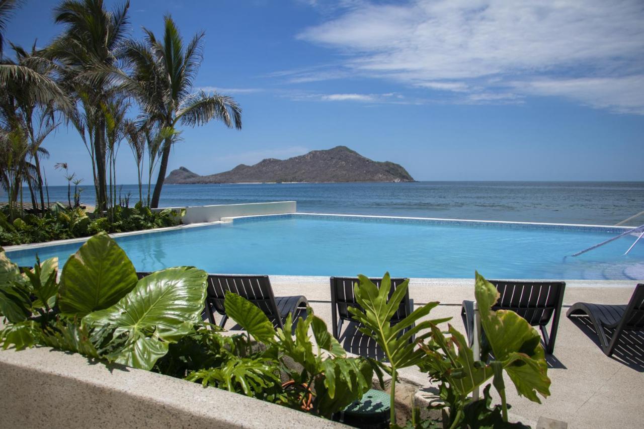 Viaggio Resort Mazatlan Exterior photo View of the Bay of Conchas, with the island of San Cristóbal in the background.